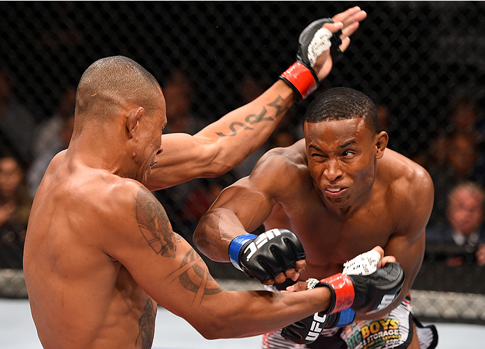 HOLLYWOOD, FL - JUNE 27: (R-L) Joe Merritt punches Alex Oliveira of Brazil in their welterweight during the UFC Fight Night event at the Hard Rock Live on June 27, 2015 in Hollywood, Florida. (Photo by Josh Hedges/Zuffa LLC/Zuffa LLC via Getty Images)