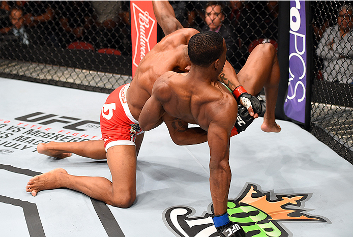 HOLLYWOOD, FL - JUNE 27: (L-R) Alex Oliveira of Brazil takes down Joe Merritt in their welterweight during the UFC Fight Night event at the Hard Rock Live on June 27, 2015 in Hollywood, Florida. (Photo by Josh Hedges/Zuffa LLC/Zuffa LLC via Getty Images