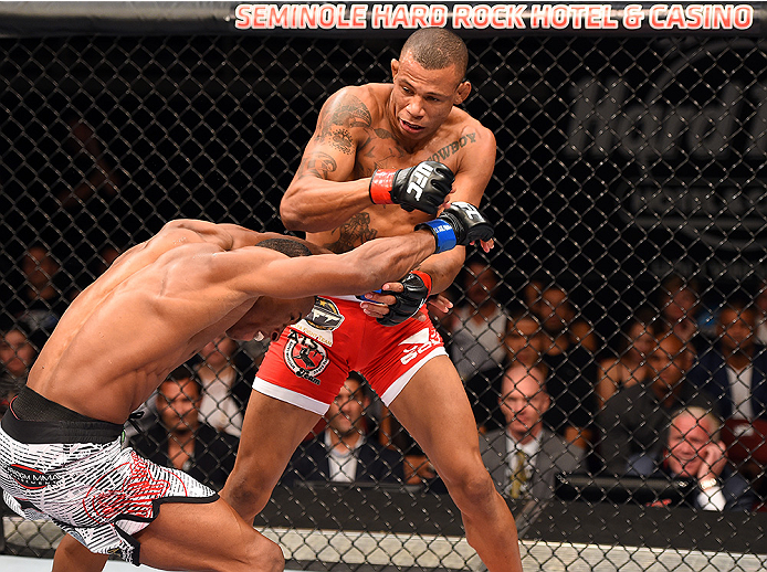 HOLLYWOOD, FL - JUNE 27: (R-L) Alex Oliveira of Brazil throws a punch against Joe Merritt in their welterweight during the UFC Fight Night event at the Hard Rock Live on June 27, 2015 in Hollywood, Florida. (Photo by Josh Hedges/Zuffa LLC/Zuffa LLC via