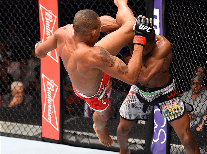 HOLLYWOOD, FL - JUNE 27: (L-R) Alex Oliveira of Brazil throws a flying knee against Joe Merritt in their welterweight during the UFC Fight Night event at the Hard Rock Live on June 27, 2015 in Hollywood, Florida. (Photo by Josh Hedges/Zuffa LLC/Zuffa LL