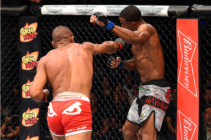 HOLLYWOOD, FL - JUNE 27: (L-R) Alex Oliveira of Brazil punches Joe Merritt in their welterweight during the UFC Fight Night event at the Hard Rock Live on June 27, 2015 in Hollywood, Florida. (Photo by Josh Hedges/Zuffa LLC/Zuffa LLC via Getty Images)
