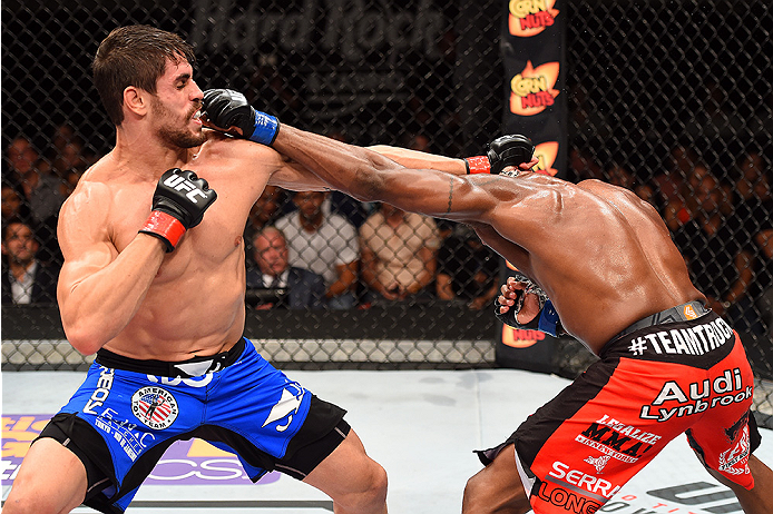 HOLLYWOOD, FL - JUNE 27: (L-R) Antonio Carlos Junior of Brazil punches Eddie Gordon in their middleweight during the UFC Fight Night event at the Hard Rock Live on June 27, 2015 in Hollywood, Florida. (Photo by Josh Hedges/Zuffa LLC/Zuffa LLC via Getty I