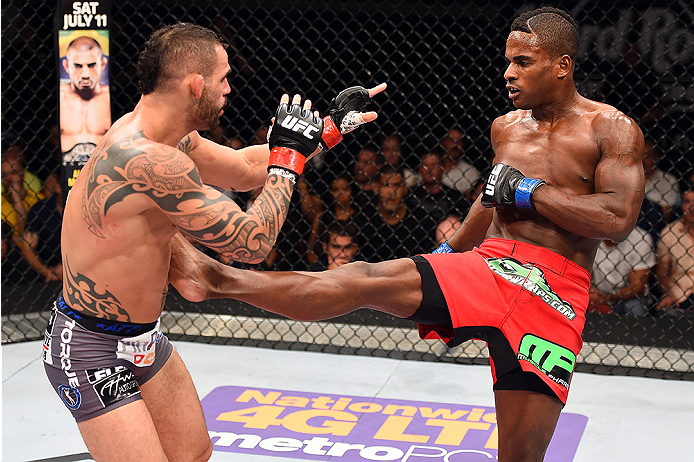 HOLLYWOOD, FL - JUNE 27: (R-L) Lorenz Larkin kicks Santiago Ponzinibbio of Argentina in their welterweight during the UFC Fight Night event at the Hard Rock Live on June 27, 2015 in Hollywood, Florida. (Photo by Josh Hedges/Zuffa LLC/Zuffa LLC via Getty