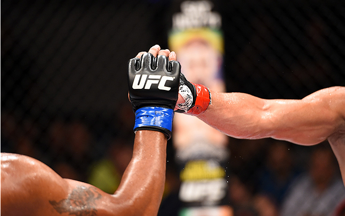 HOLLYWOOD, FL - JUNE 27: (L-R) Yoel Romero and Lyoto Machida touch gloves before round two in their middleweight during the UFC Fight Night event at the Hard Rock Live on June 27, 2015 in Hollywood, Florida. (Photo by Josh Hedges/Zuffa LLC/Zuffa LLC via
