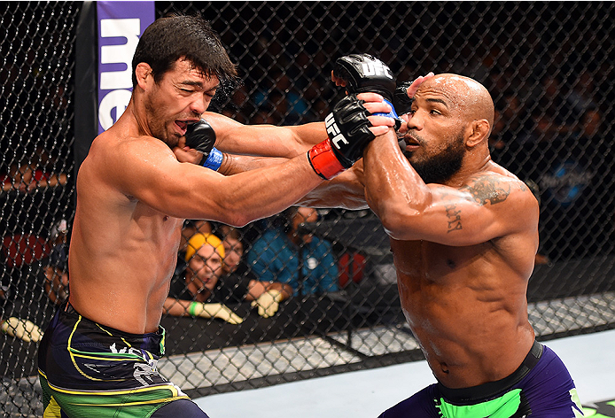 HOLLYWOOD, FL - JUNE 27: (R-L) Yoel Romero of Cuba punches Lyoto Machida of Brazil in their middleweight during the UFC Fight Night event at the Hard Rock Live on June 27, 2015 in Hollywood, Florida. (Photo by Josh Hedges/Zuffa LLC/Zuffa LLC via Getty Im
