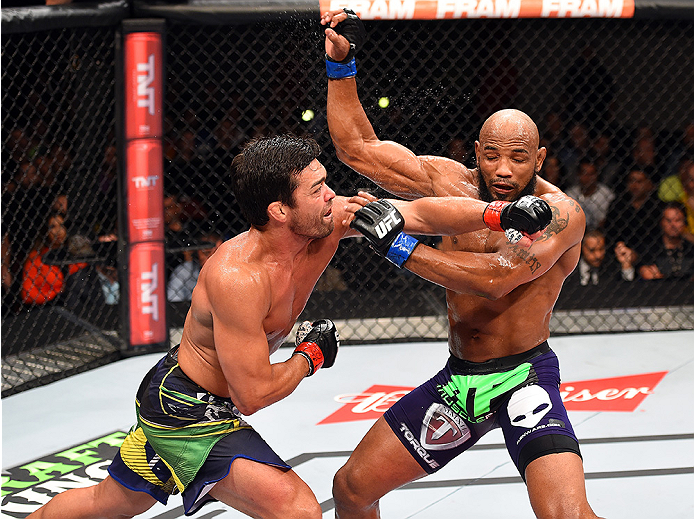 HOLLYWOOD, FL - JUNE 27: (L-R) Lyoto Machida of Brazil punches Yoel Romero of Cuba in their middleweight during the UFC Fight Night event at the Hard Rock Live on June 27, 2015 in Hollywood, Florida. (Photo by Josh Hedges/Zuffa LLC/Zuffa LLC via Getty Im