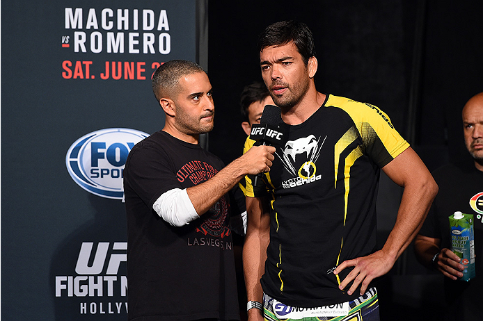 HOLLYWOOD, FL - JUNE 26: UFC commentator Jon Anik interviews Lyoto Machida of Brazil during the UFC weigh-in at the Seminole Hard Rock Casino on June 26, 2015 in Hollywood, Florida. (Photo by Josh Hedges/Zuffa LLC/Zuffa LLC via Getty Images)
