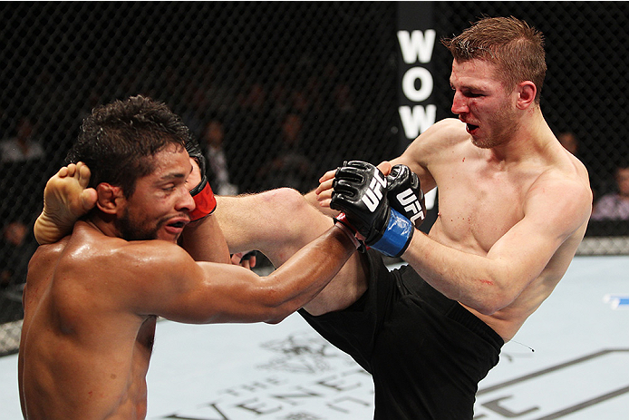 SAITAMA, JAPAN - SEPTEMBER 20: Daniel Hooker lands a kick on Maximo Blanco in their featherweight bout during the UFC Fight Night event inside the Saitama Arena on September 20, 2014 in Saitama, Japan. (Photo by Mitch Viquez/Zuffa LLC/Zuffa LLC via Getty