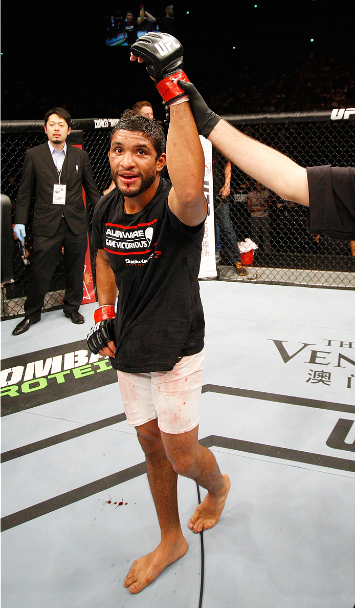 SAITAMA, JAPAN - SEPTEMBER 20: Maximo Blanco's hand is raised after defeating Daniel Hooker in their featherweight bout during the UFC Fight Night event inside the Saitama Arena on September 20, 2014 in Saitama, Japan. (Photo by Mitch Viquez/Zuffa LLC/Zuf