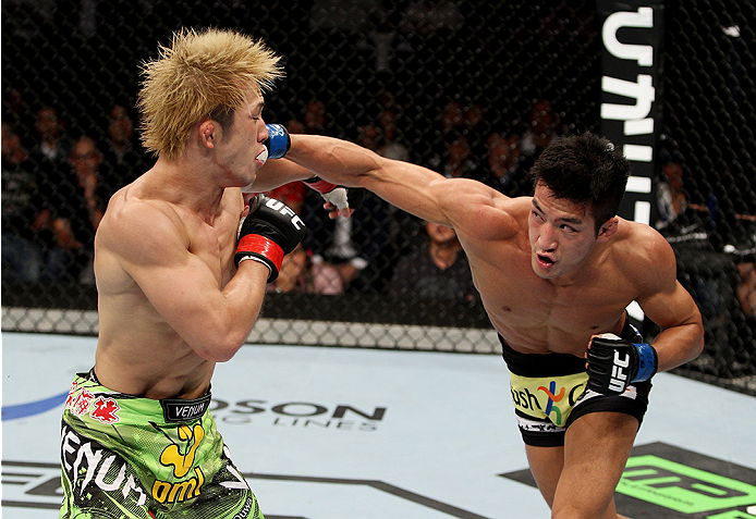 SAITAMA, JAPAN - SEPTEMBER 20: Kyung Ho Kang throws a punch on Michinori Tanaka in their bantamweight bout during the UFC Fight Night event inside the Saitama Arena on September 20, 2014 in Saitama, Japan. (Photo by Mitch Viquez/Zuffa LLC/Zuffa LLC via G