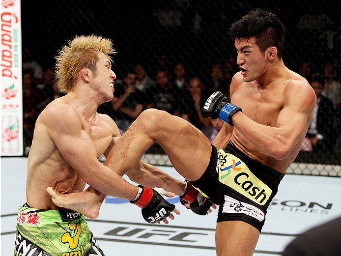 SAITAMA, JAPAN - SEPTEMBER 20: Kyung Ho Kang throws a kick on Michinori Tanaka in their bantamweight bout during the UFC Fight Night event inside the Saitama Arena on September 20, 2014 in Saitama, Japan. (Photo by Mitch Viquez/Zuffa LLC/Zuffa LLC via Get