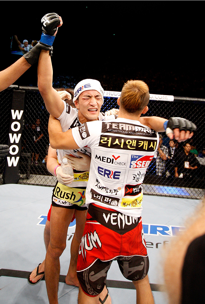 SAITAMA, JAPAN - SEPTEMBER 20: Kyung Ho Kang celebrates his win over Michinori Tanaka in their bantamweight bout during the UFC Fight Night event inside the Saitama Arena on September 20, 2014 in Saitama, Japan. (Photo by Mitch Viquez/Zuffa LLC/Zuffa LLC