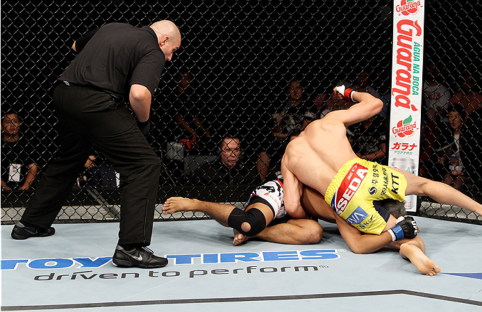 SAITAMA, JAPAN - SEPTEMBER 20: Hyun Gyu Lim throws punches on Takenori Sato in their welterweight bout during the UFC Fight Night event inside the Saitama Arena on September 20, 2014 in Saitama, Japan. (Photo by Mitch Viquez/Zuffa LLC/Zuffa LLC via Getty