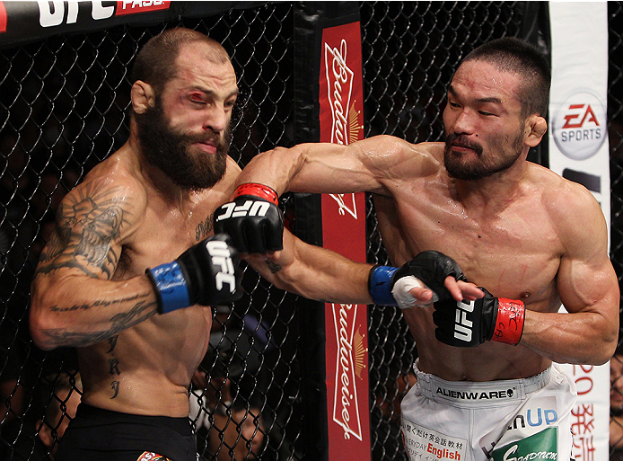 SAITAMA, JAPAN - SEPTEMBER 20: Katsunori Kikuno lands a punch on Sam Sicilia in their featherweight bout during the UFC Fight Night event inside the Saitama Arena on September 20, 2014 in Saitama, Japan. (Photo by Mitch Viquez/Zuffa LLC/Zuffa LLC via Ge