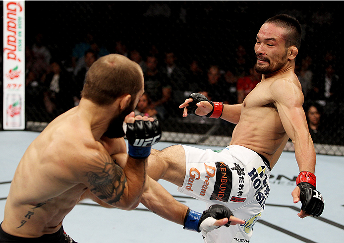 SAITAMA, JAPAN - SEPTEMBER 20: Katsunori Kikuno throws a kick on Sam Sicilia in their featherweight bout during the UFC Fight Night event inside the Saitama Arena on September 20, 2014 in Saitama, Japan. (Photo by Mitch Viquez/Zuffa LLC/Zuffa LLC via Get