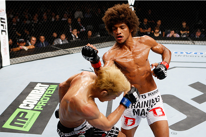 SAITAMA, JAPAN - SEPTEMBER 20: Alex Caceres and Masanori Kanehara exchange a fury of punches in their bantamweight bout during the UFC Fight Night event inside the Saitama Arena on September 20, 2014 in Saitama, Japan. (Photo by Mitch Viquez/Zuffa LLC/Zu