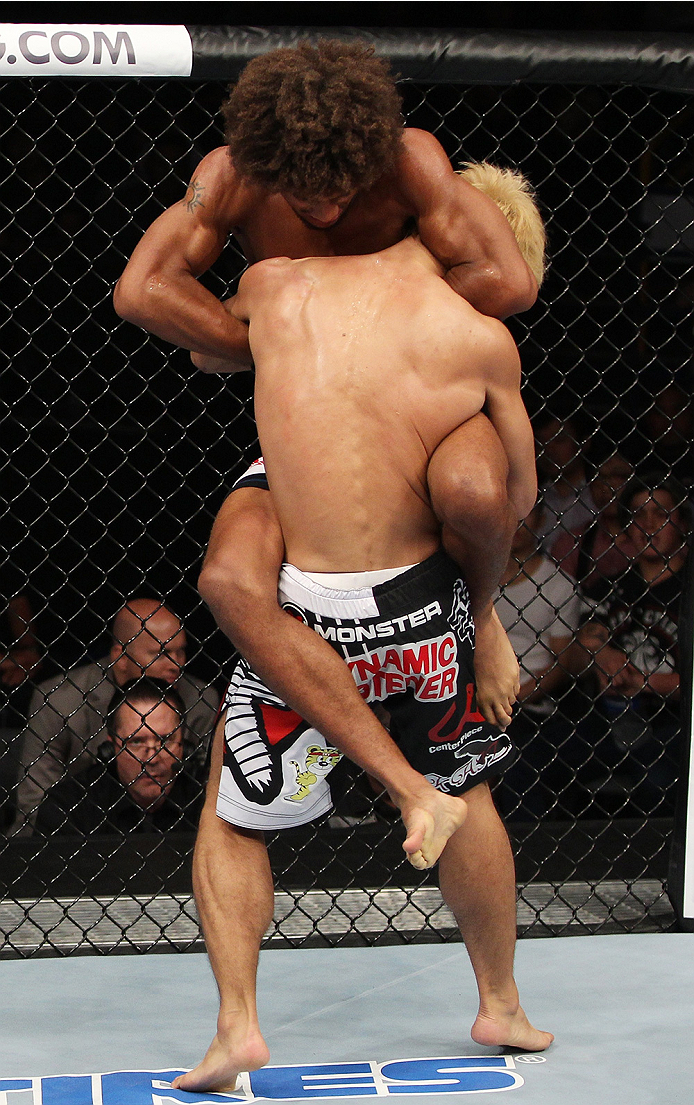 SAITAMA, JAPAN - SEPTEMBER 20: Alex Caceres goes for a submission on Masanori Kanehara in their bantamweight bout during the UFC Fight Night event inside the Saitama Arena on September 20, 2014 in Saitama, Japan. (Photo by Mitch Viquez/Zuffa LLC/Zuffa LL
