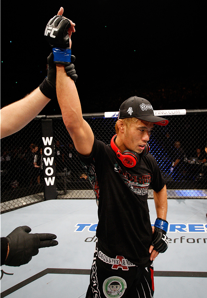 SAITAMA, JAPAN - SEPTEMBER 20: Masanori Kanehara celebrates his win over Alex Caceres in their bantamweight bout during the UFC Fight Night event inside the Saitama Arena on September 20, 2014 in Saitama, Japan. (Photo by Mitch Viquez/Zuffa LLC/Zuffa LLC