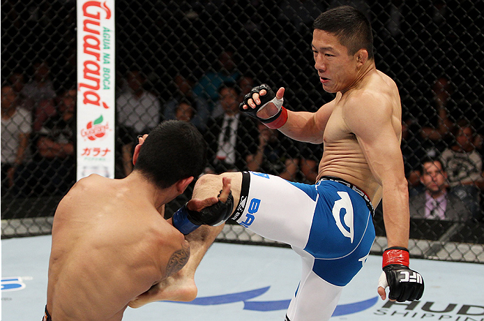 SAITAMA, JAPAN - SEPTEMBER 20: Kyoji Horiguchi throws a kick at Jon Delos Reyes in their flyweight bout during the UFC Fight Night event inside the Saitama Arena on September 20, 2014 in Saitama, Japan. (Photo by Mitch Viquez/Zuffa LLC/Zuffa LLC via Getty
