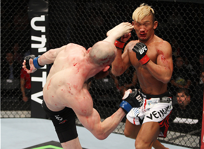 SAITAMA, JAPAN - SEPTEMBER 20: Richard Walsh goes for a kick on Kiichi Kunimoto in their welterweight bout during the UFC Fight Night event inside the Saitama Arena on September 20, 2014 in Saitama, Japan. (Photo by Mitch Viquez/Zuffa LLC/Zuffa LLC via Ge