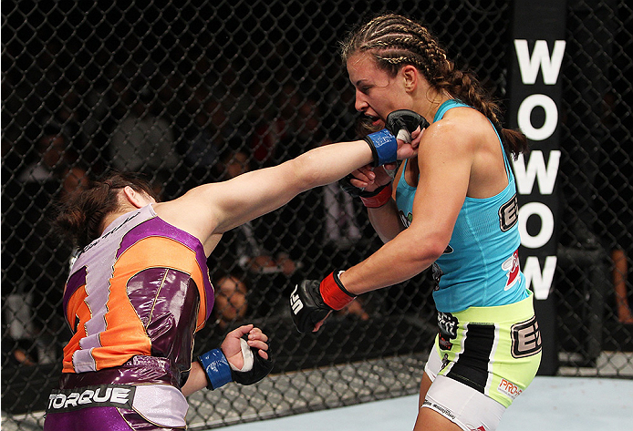 SAITAMA, JAPAN - SEPTEMBER 20:Rin Nakai punches Miesha Tate in their bantamweight bout during the UFC Fight Night event inside the Saitama Arena on September 20, 2014 in Saitama, Japan. (Photo by Mitch Viquez/Zuffa LLC/Zuffa LLC via Getty Images)