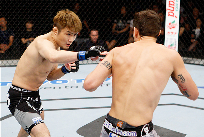 SAITAMA, JAPAN - SEPTEMBER 20: Takanori Gomi throws a punch at Myles Jury in their lightweight bout during the UFC Fight Night event inside the Saitama Arena on September 20, 2014 in Saitama, Japan. (Photo by Mitch Viquez/Zuffa LLC/Zuffa LLC via Getty Im