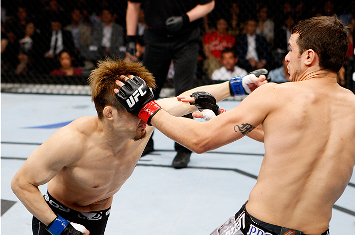 SAITAMA, JAPAN - SEPTEMBER 20: Takanori Gomi throws a punch at Myles Jury in their lightweight bout during the UFC Fight Night event inside the Saitama Arena on September 20, 2014 in Saitama, Japan. (Photo by Mitch Viquez/Zuffa LLC/Zuffa LLC via Getty Im