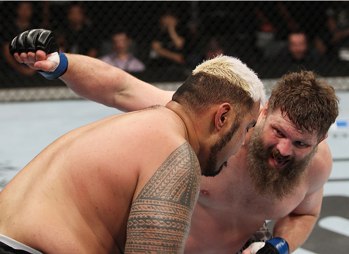 SAITAMA, JAPAN - SEPTEMBER 20: Roy Nelson throws a punch at Mark Hunt in their heavyweight bout during the UFC Fight Night event inside the Saitama Arena on September 20, 2014 in Saitama, Japan. (Photo by Mitch Viquez/Zuffa LLC/Zuffa LLC via Getty Images)