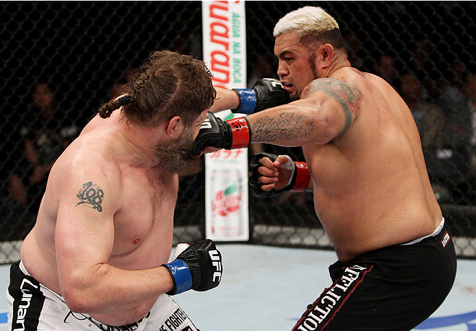 SAITAMA, JAPAN - SEPTEMBER 20: Roy Nelson punches Mark Hunt in their heavyweight bout during the UFC Fight Night event inside the Saitama Arena on September 20, 2014 in Saitama, Japan. (Photo by Mitch Viquez/Zuffa LLC/Zuffa LLC via Getty Images)