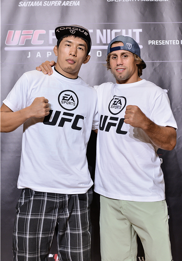 TOKYO, JAPAN - SEPTEMBER 17: Takeya Mizugaki (L) and Urijah Faber pose for the media during the UFC Ultimate Media Day at the Hilton Tokyo on September 17, 2014 in Tokyo, Japan. (Photo by Keith Tsuji/Zuffa LLC/Zuffa LLC via Getty Images)