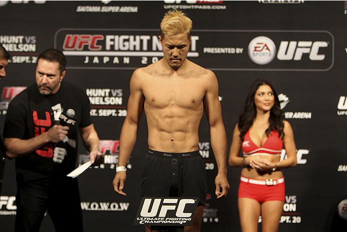SAITAMA, JAPAN - SEPTEMBER 19: Kazuki
Tokudome steps on the scale during the UFC Fight Night weigh-in event on September 19, 2014 in Saitama, Japan. (Photo by Mitch Viquez/Zuffa LLC/Zuffa LLC via Getty Images)