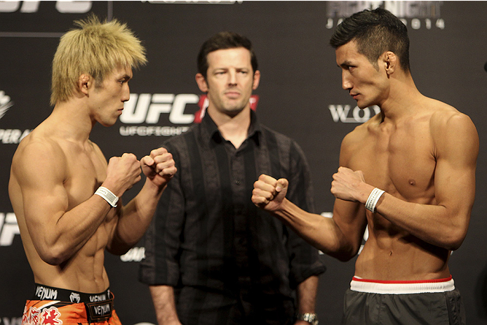 SAITAMA, JAPAN - SEPTEMBER 19: (L and R) Michinori Tanaka and Kyung Ho Kang during the UFC Fight Night weigh-in event on September 19, 2014 in Saitama, Japan. (Photo by Mitch Viquez/Zuffa LLC/Zuffa LLC via Getty Images)