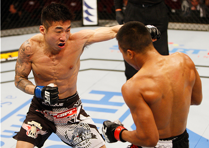MANILA, PHILIPPINES - MAY 16: Yao Zhikui of China throws a punch at Nolan Ticman of the United State in their flyweight fight during the UFC Fight Night event at the Mall of Asia Arena on May 16, 2015 in Manila, Philippines. (Photo by Mitch Viquez/Zuffa
