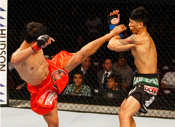 MANILA, PHILIPPINES - MAY 16: Roldan Sangcha-An of the Philippines kicks Jon Delos Reyes of Guam in their flyweight fight during the UFC Fight Night event at the Mall of Asia Arena on May 16, 2015 in Manila, Philippines. (Photo by Mitch Viquez/Zuffa LLC/