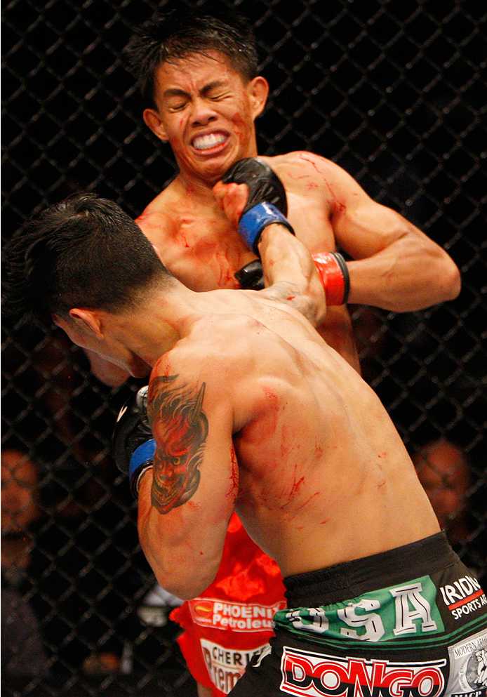 MANILA, PHILIPPINES - MAY 16: Jon Delos Reyes of Guam punches Roldan Sangcha-An of the Philippines in their flyweight fight during the UFC Fight Night event at the Mall of Asia Arena on May 16, 2015 in Manila, Philippines. (Photo by Mitch Viquez/Zuffa LL