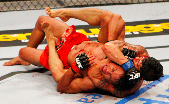 MANILA, PHILIPPINES - MAY 16: Jon Delos Reyes of Guam locks in a submission on Roldan Sangcha-An of the Philippines in their flyweight fight during the UFC Fight Night event at the Mall of Asia Arena on May 16, 2015 in Manila, Philippines. (Photo by Mitc