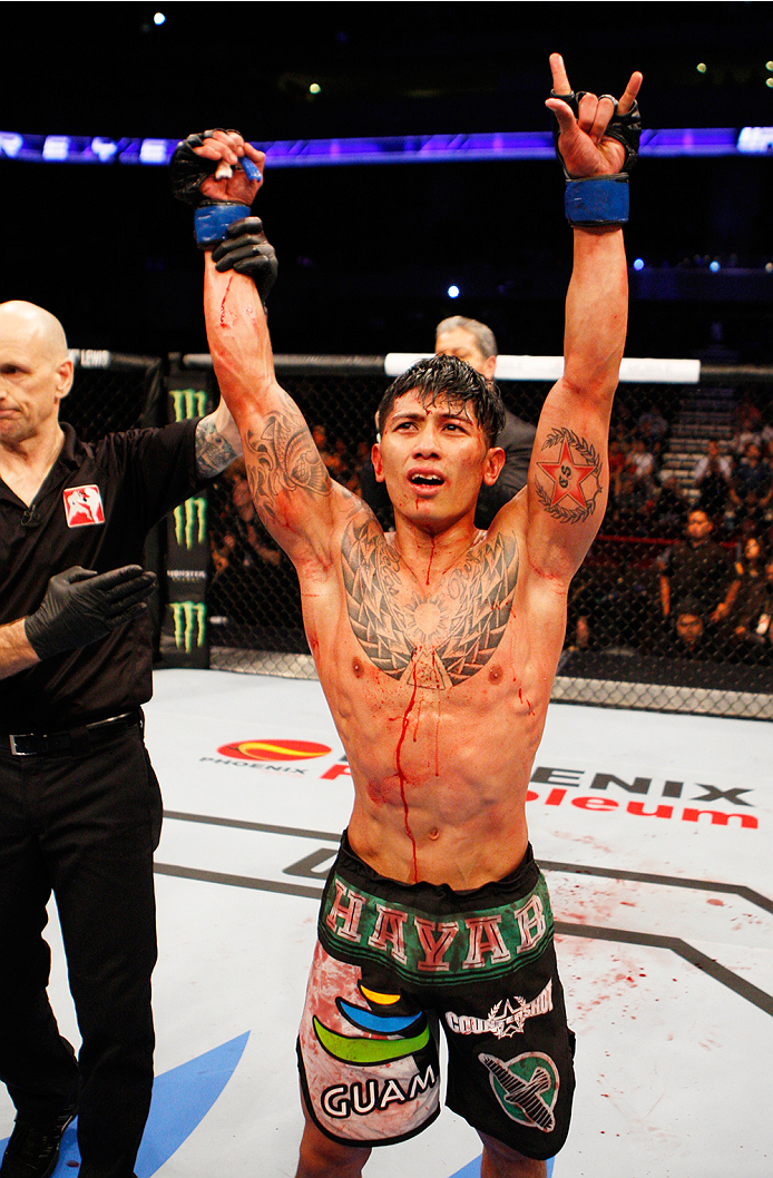 MANILA, PHILIPPINES - MAY 16: Jon Delos Reyes of Guam celebrates after his win over Roldan Sangcha-An of the Phillipines in their flyweight fight during the UFC Fight Night event at the Mall of Asia Arena on May 16, 2015 in Manila, Philippines. (Photo by