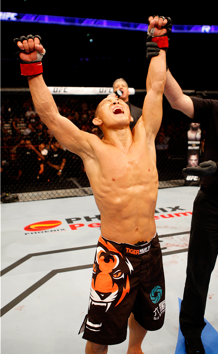 MANILA, PHILIPPINES - MAY 16: Ning Guangyou of China celebrates after his win over Royston Wee of Singapore in their bantamweight fight during the UFC Fight Night event at the Mall of Asia Arena on May 16, 2015 in Manila, Philippines. (Photo by Mitch Viq
