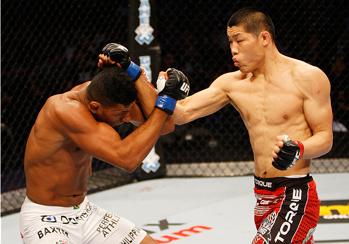 MANILA, PHILIPPINES - MAY 16: Li Jingling of China punches Dhiego Lima of Brazil in their welterweight fight during the UFC Fight Night event at the Mall of Asia Arena on May 16, 2015 in Manila, Philippines. (Photo by Mitch Viquez/Zuffa LLC/Zuffa LLC via