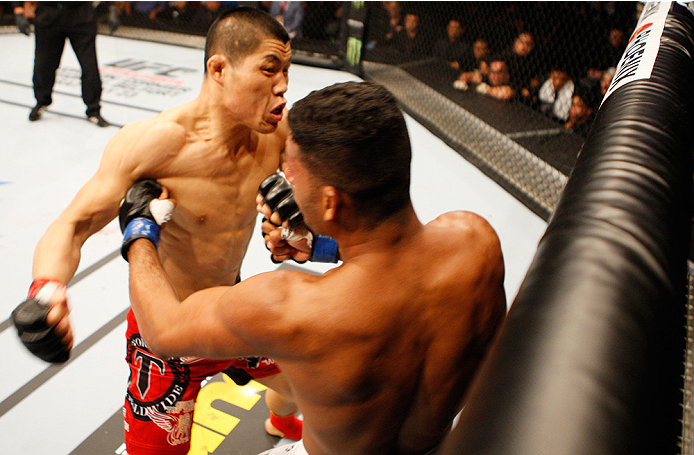 MANILA, PHILIPPINES - MAY 16: Li Jingling of China punches Dhiego Lima of Brazil in their welterweight fight during the UFC Fight Night event at the Mall of Asia Arena on May 16, 2015 in Manila, Philippines. (Photo by Mitch Viquez/Zuffa LLC/Zuffa LLC via