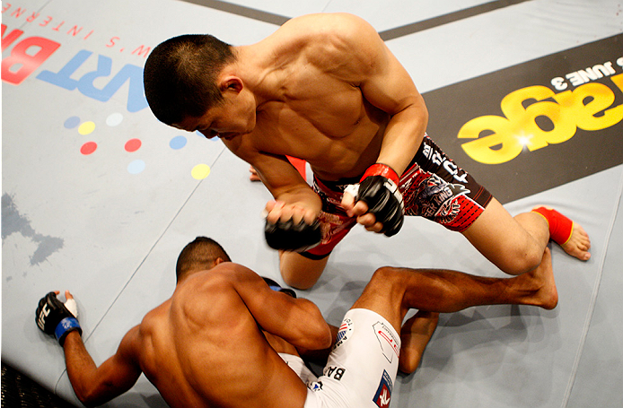 MANILA, PHILIPPINES - MAY 16: Li Jingling of China punches Dhiego Lima of Brazil in their welterweight fight during the UFC Fight Night event at the Mall of Asia Arena on May 16, 2015 in Manila, Philippines. (Photo by Mitch Viquez/Zuffa LLC/Zuffa LLC via