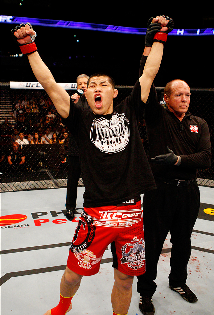 MANILA, PHILIPPINES - MAY 16: Li Jingling of China celebrates after defeating Dhiego Lima of Brazil in their welterweight fight during the UFC Fight Night event at the Mall of Asia Arena on May 16, 2015 in Manila, Philippines. (Photo by Mitch Viquez/Zuff