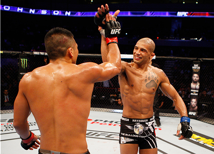 MANILA, PHILIPPINES - MAY 16: (L to R) Zhang Lipeng of China and Kajan Johnson of Canada congratulate each other after their lightweight fight during the UFC Fight Night event at the Mall of Asia Arena on May 16, 2015 in Manila, Philippines. (Photo by Mit