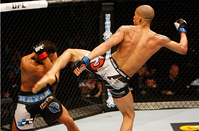 MANILA, PHILIPPINES - MAY 16: Kajan Johnson of Canada kicks Zhang Lipeng of China in their lightweight fight during the UFC Fight Night event at the Mall of Asia Arena on May 16, 2015 in Manila, Philippines. (Photo by Mitch Viquez/Zuffa LLC/Zuffa LLC via
