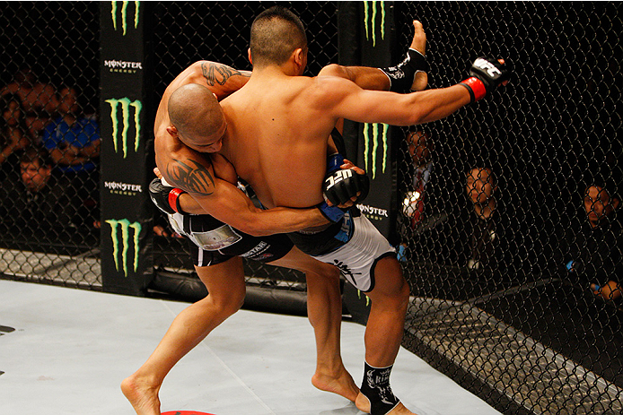 MANILA, PHILIPPINES - MAY 16: Kajan Johnson of Canada takes down Zhang Lipeng of China in their lightweight fight during the UFC Fight Night event at the Mall of Asia Arena on May 16, 2015 in Manila, Philippines. (Photo by Mitch Viquez/Zuffa LLC/Zuffa LLC