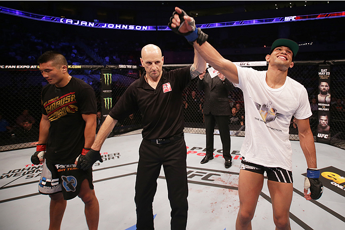 MANILA, PHILIPPINES - MAY 16: Kajan Johnson of Canada celebrates after his win over Zhang Lipeng of China in their lightweight fight during the UFC Fight Night event at the Mall of Asia Arena on May 16, 2015 in Manila, Philippines. (Photo by Mitch Viquez