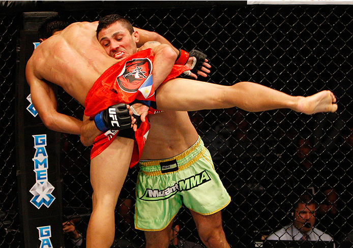 MANILA, PHILIPPINES - MAY 16: Levan Makashvili of the United States goes for a takedown on Mark Eddiva of the Philippines in their featherweight fight during the UFC Fight Night event at the Mall of Asia Arena on May 16, 2015 in Manila, Philippines. (Phot