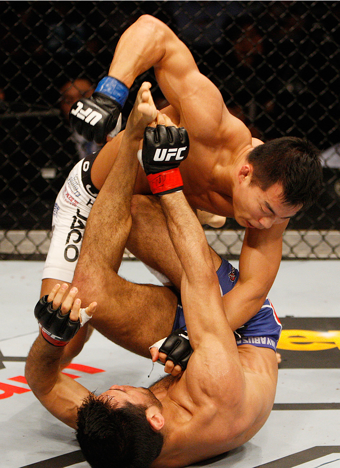 MANILA, PHILIPPINES - MAY 16: Yui Chul Nam of South Korea punches Phillipe Nover of the United States in their featherweight fight during the UFC Fight Night event at the Mall of Asia Arena on May 16, 2015 in Manila, Philippines. (Photo by Mitch Viquez/Zu