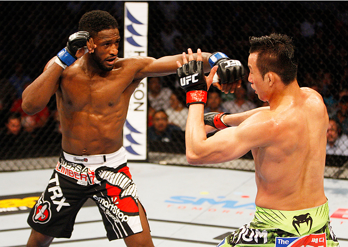 MANILA, PHILIPPINES - MAY 16: Neil Magny of the United States throws a punch at Hyun Gyu Lim of South Korea in their welterweight fight during the UFC Fight Night event at the Mall of Asia Arena on May 16, 2015 in Manila, Philippines. (Photo by Mitch Viqu