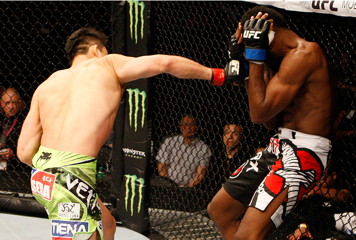 MANILA, PHILIPPINES - MAY 16: Hyun Gyu Lim of South Korea punches Neil Magny of the United States in their welterweight fight during the UFC Fight Night event at the Mall of Asia Arena on May 16, 2015 in Manila, Philippines. (Photo by Mitch Viquez/Zuffa